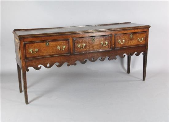 A George III crossbanded oak dresser base, W.5ft 11in. D.1ft 6in. H.2ft 9in.